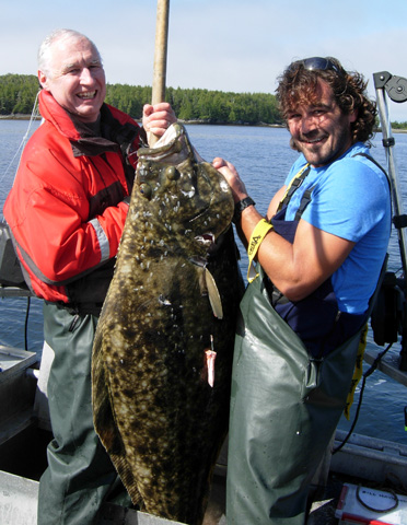 Bill Haymond and Myles Sidorak with a big halibut